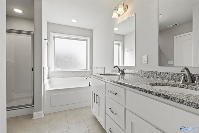 bathroom with vanity, independent shower and bath, and tile patterned flooring