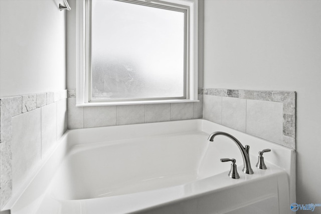 bathroom featuring a tub to relax in