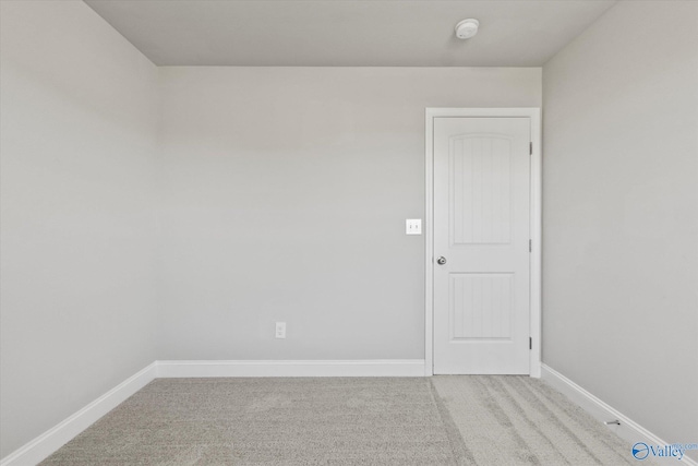 empty room featuring light colored carpet