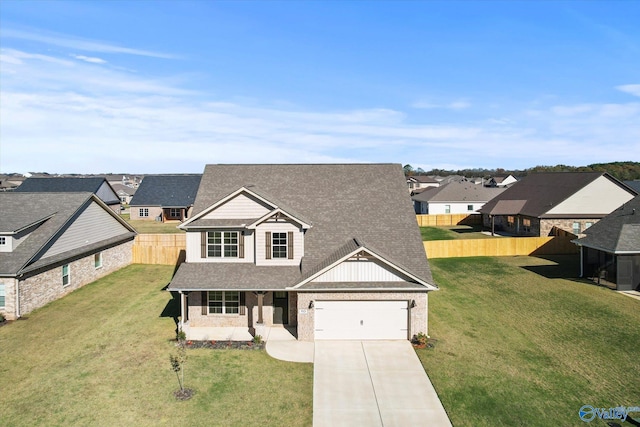 view of front of home featuring a garage and a front lawn