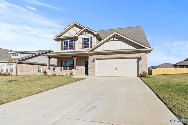 craftsman house featuring a garage and a front lawn