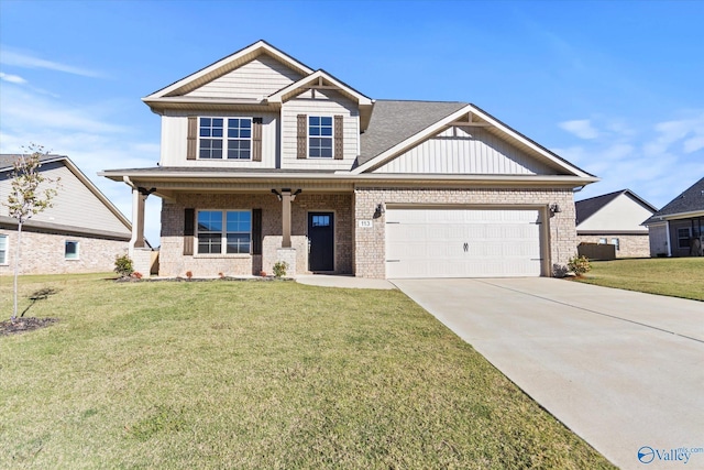 craftsman inspired home featuring a garage and a front lawn