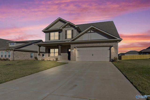 craftsman-style home with a garage and a lawn