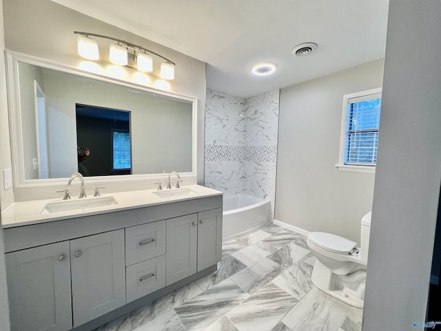 full bath featuring marble finish floor, visible vents, toilet, and a sink