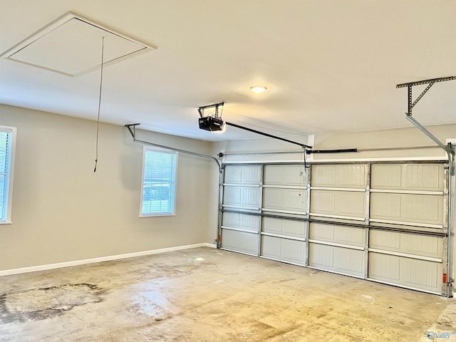 garage featuring a garage door opener and baseboards