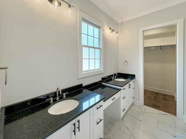 bathroom with vanity and crown molding