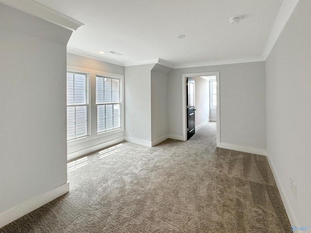 carpeted empty room featuring ornamental molding