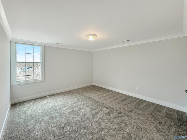 carpeted spare room with crown molding