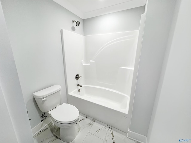 bathroom featuring shower / bathtub combination and toilet