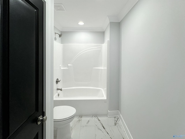 bathroom with ornamental molding,  shower combination, and toilet