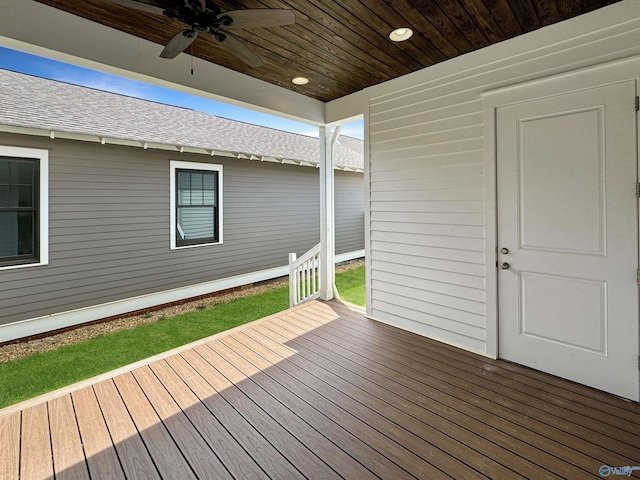 wooden deck featuring ceiling fan