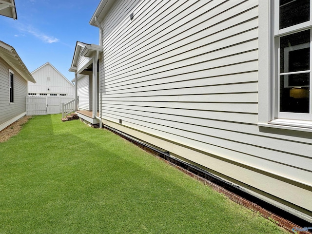 view of home's exterior with a yard