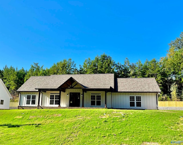 ranch-style home featuring a front yard