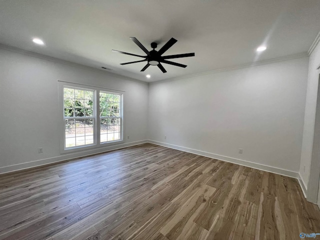 spare room with ornamental molding, hardwood / wood-style floors, and ceiling fan