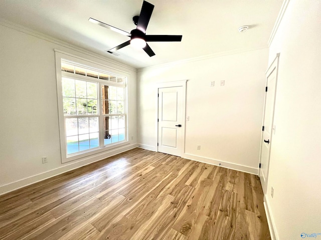 unfurnished bedroom featuring crown molding, light hardwood / wood-style floors, and ceiling fan