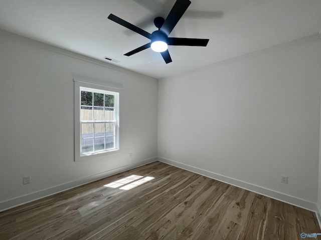 spare room featuring ceiling fan and wood-type flooring