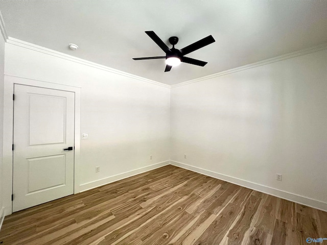 empty room with crown molding, hardwood / wood-style floors, and ceiling fan