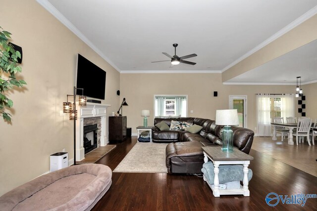 205 Maplebrook Dr, Madison, AL 35756 - living area with a ceiling fan, dark wood-style floors, ornamental molding, and a fireplace