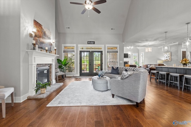 68 Natures Ridge Way, Huntsville, AL 35803 - living room with a glass covered fireplace, a ceiling fan, high vaulted ceiling, dark wood-style floors, and french doors