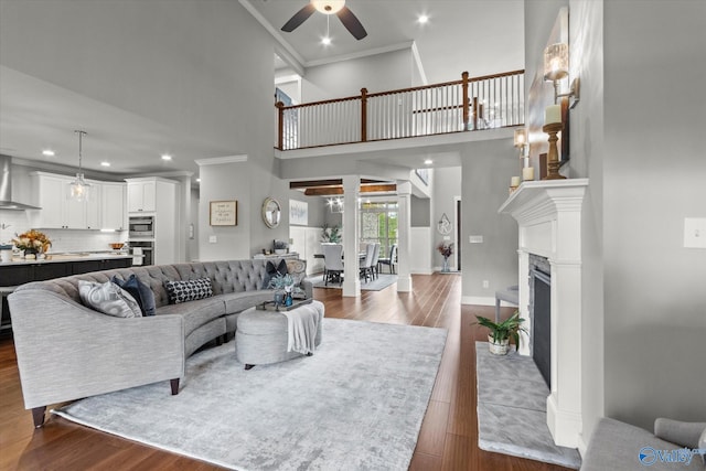 68 Natures Ridge Way, Huntsville, AL 35803 - living room with a ceiling fan, dark wood-style flooring, recessed lighting, baseboards, and a fireplace