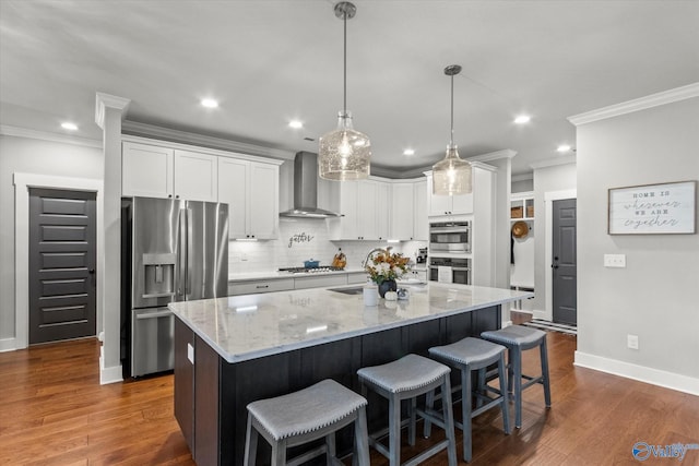 68 Natures Ridge Way, Huntsville, AL 35803 - kitchen with appliances with stainless steel finishes, wall chimney exhaust hood, crown molding, recessed lighting, and white cabinetry