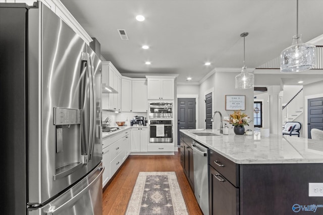 68 Natures Ridge Way, Huntsville, AL 35803 - kitchen featuring stainless steel appliances, a sink, white cabinetry, a spacious island, and recessed lighting