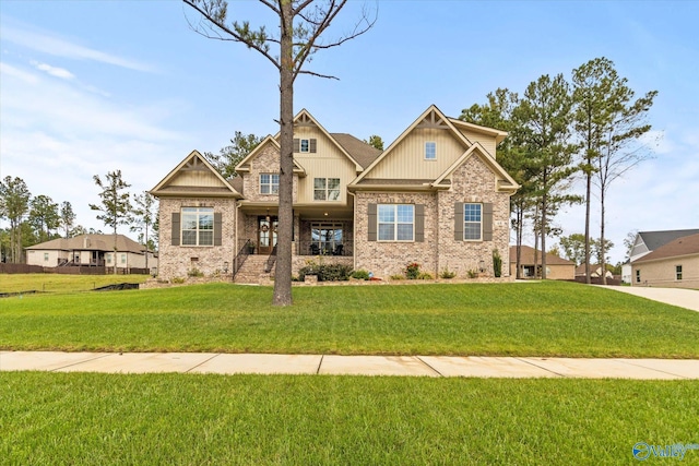 craftsman house with a front lawn