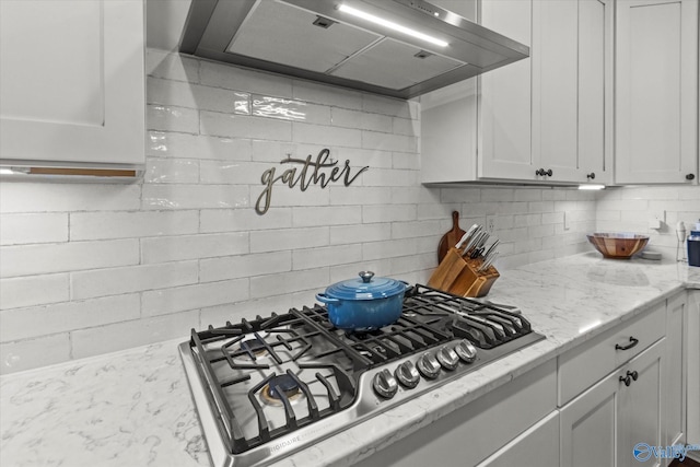 68 Natures Ridge Way, Huntsville, AL 35803 - kitchen featuring extractor fan, stainless steel gas stovetop, decorative backsplash, and white cabinetry
