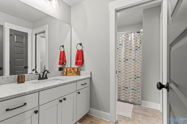 68 Natures Ridge Way, Huntsville, AL 35803 - full bath with vanity, baseboards, a shower with shower curtain, and wood finished floors