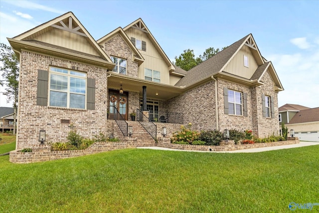 68 Natures Ridge Way, Huntsville, AL 35803 - craftsman-style home with a front yard, board and batten siding, brick siding, and covered porch