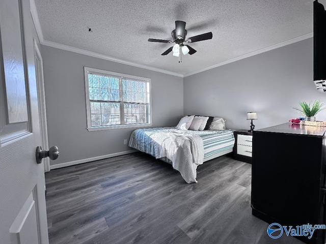 bedroom with a textured ceiling, dark wood-style floors, crown molding, baseboards, and ceiling fan