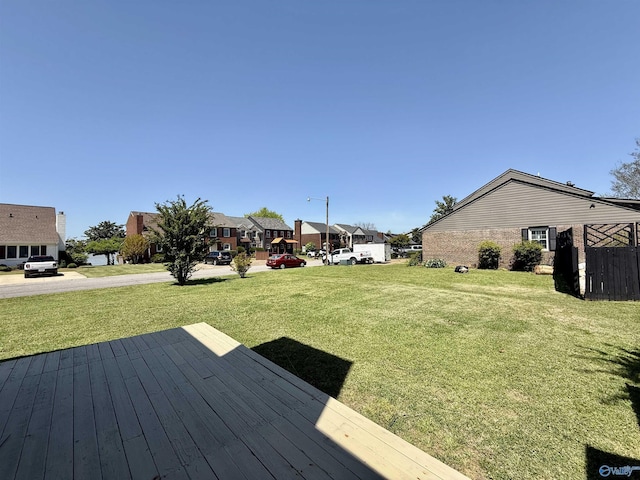 view of yard featuring a residential view