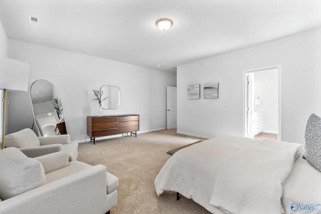 bedroom featuring visible vents, baseboards, and light colored carpet