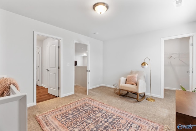 interior space with carpet, visible vents, and baseboards