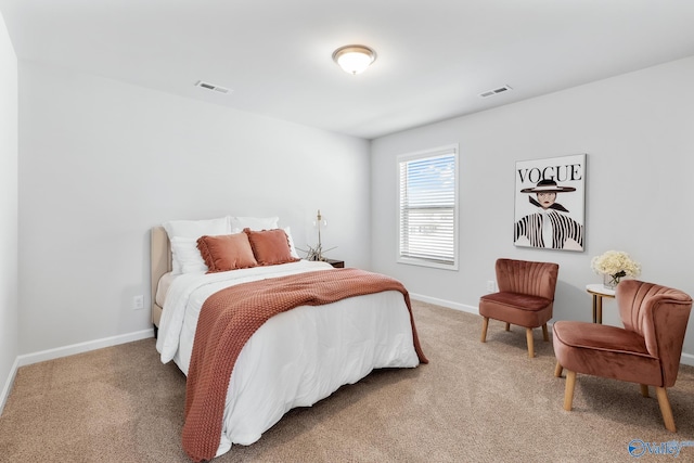 bedroom with carpet floors, visible vents, and baseboards