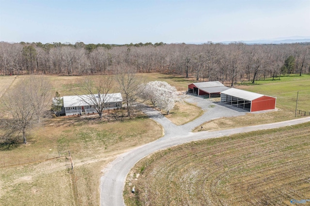 bird's eye view with a view of trees and a rural view