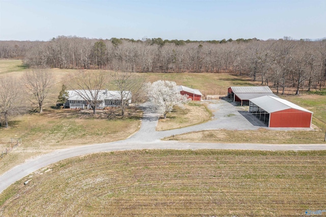 bird's eye view featuring a rural view and a forest view