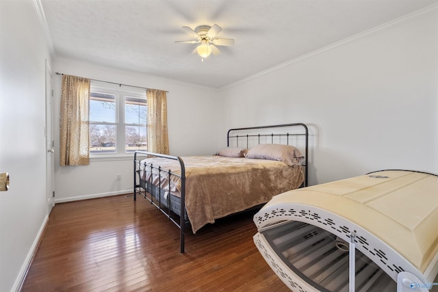 bedroom with ceiling fan, baseboards, wood-type flooring, and ornamental molding