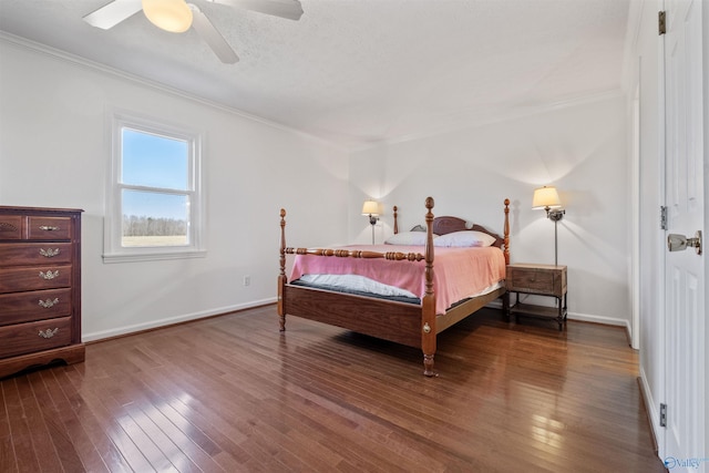 bedroom featuring dark wood-type flooring and ornamental molding