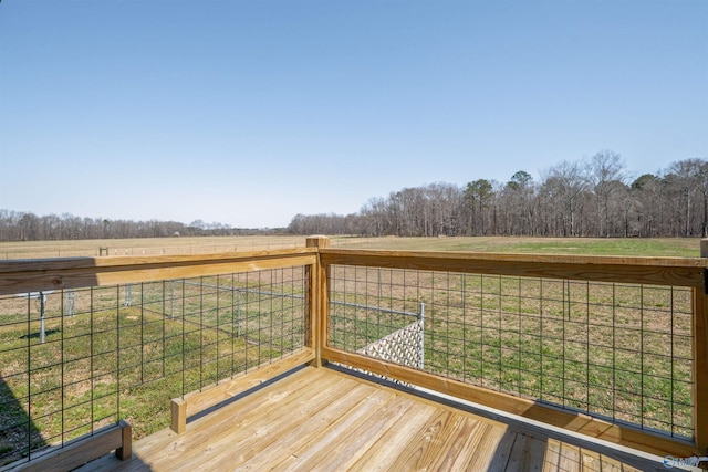 wooden terrace featuring a rural view