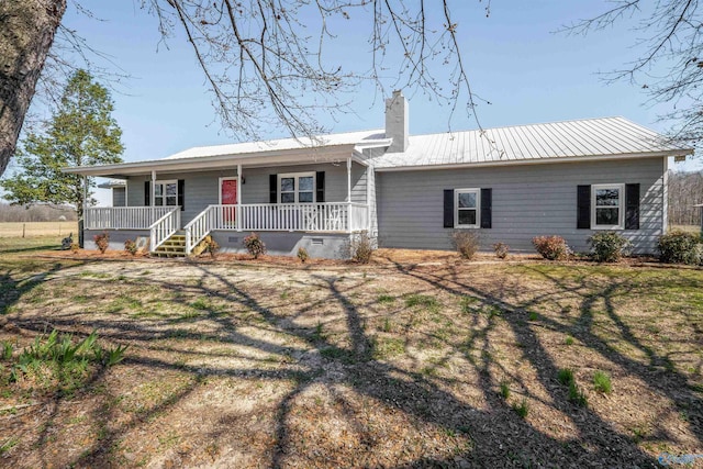 single story home with a chimney, crawl space, covered porch, and metal roof