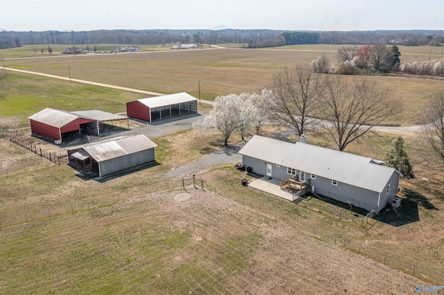 birds eye view of property with a rural view