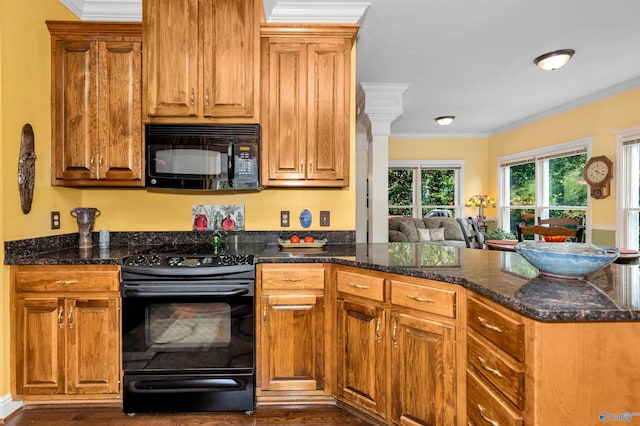 kitchen featuring dark stone countertops, crown molding, dark hardwood / wood-style flooring, and black appliances