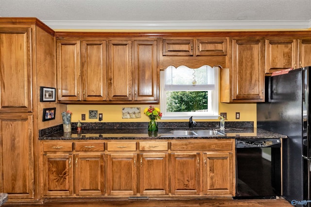 kitchen featuring sink, a textured ceiling, ornamental molding, dark stone counters, and black appliances