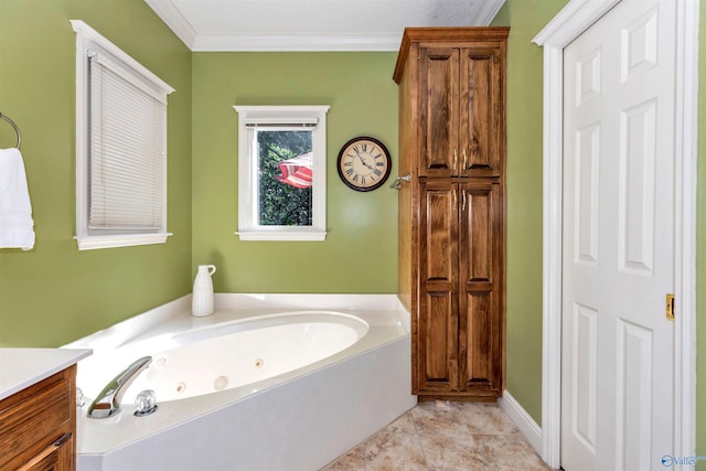 bathroom featuring tile patterned flooring, crown molding, vanity, and a bathtub