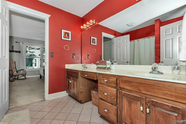 bathroom featuring vanity, a shower with curtain, and tile patterned floors