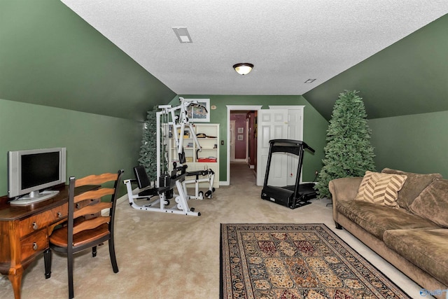 carpeted home office featuring lofted ceiling and a textured ceiling