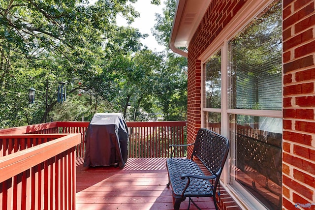 wooden terrace featuring area for grilling