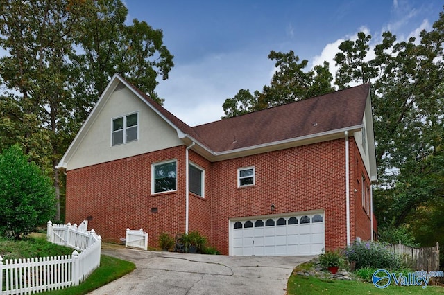 view of side of property featuring a garage