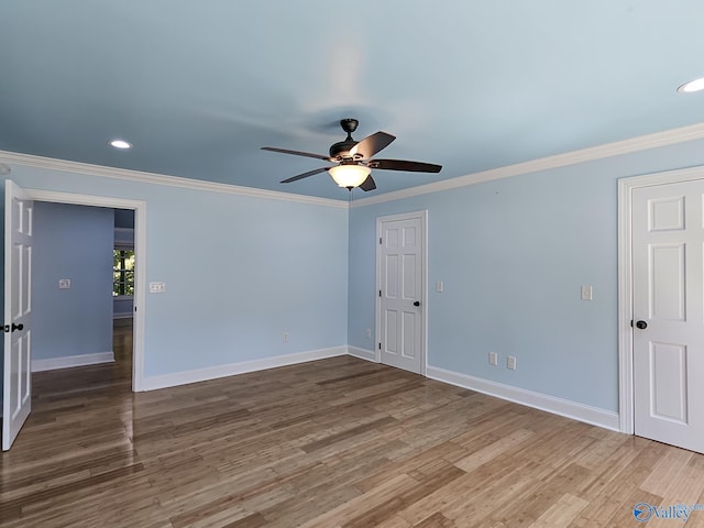 unfurnished room featuring crown molding, ceiling fan, and wood-type flooring